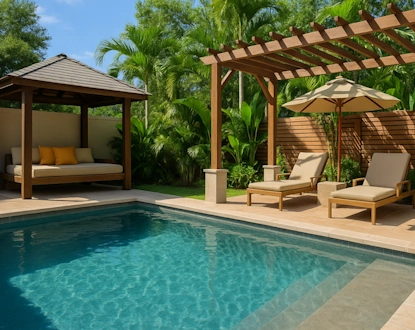 A residential swimming pool surrounded by palm trees, lounge chairs, and a pergola, creating a relaxing tropical oasis representing pools that could be built by Professional Pools, a trusted pool contractor in Asheboro NC.